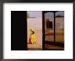 A Person Walking Past An Open Doorway by Michael S. Lewis Limited Edition Pricing Art Print