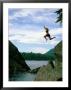 A Climber Freefalls From A Cliff Into The Claquot Sound In British Columbia by Barry Tessman Limited Edition Print