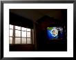 Stormy View Outside Window With Television Displaying A Hurricane Watch by Raul Touzon Limited Edition Pricing Art Print