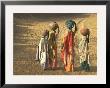 Girls Wearing Sari With Water Jars Walking In The Desert, Pushkar, Rajasthan, India by Keren Su Limited Edition Print