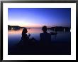 Silhouetted Couple At Dusk At Huntress Marina, Port Antonio, Jamaica by Holger Leue Limited Edition Print