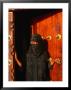 Woman In Bui-Bui Standing In Zanzibar Doorway, Looking At Camera, Lamu, Kenya by Ariadne Van Zandbergen Limited Edition Print