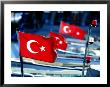 Turkish Flags On Moored Boats, Ucagiz, Turkey by Dallas Stribley Limited Edition Print
