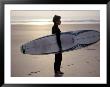 Surfer On A Beach, North Devon, England by Lauree Feldman Limited Edition Print