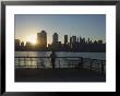 Fisherman Fishing From A Jersey City Pier At Dawn Facing The Manhattan Skyline, Jersey City by Amanda Hall Limited Edition Pricing Art Print