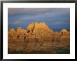 Sunset On The Claystone Buttes Of The Badlands Near Cedar Pass by Annie Griffiths Belt Limited Edition Print