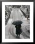 Older Woman Walking In The Snow With An Umbrella by Sam Abell Limited Edition Print