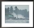 The Powerful Wind And Rain Of A Hurricane Pummel A Building by Otis Imboden Limited Edition Print