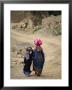 A Yemeni Woman And Child Carrying Bundles On Their Heads by Michael Melford Limited Edition Print