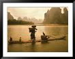 Fisherman In Bamboo Raft On The Li River, China by Keren Su Limited Edition Print