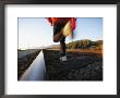 An Athlete Runs On Railroad Tracks Toward The Mountains by Joy Tessman Limited Edition Print