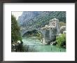 The Turkish Bridge Over The River Neretva Dividing The Town, Mostar, Bosnia, Bosnia-Herzegovina by Michael Short Limited Edition Pricing Art Print