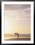 Woman Stretching On Beach At Sunrise by Kevin Radford Limited Edition Pricing Art Print