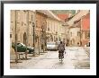 Bicyclist In Jurisics Ter Square, Western Transdanubia, Hungary by Walter Bibikow Limited Edition Print