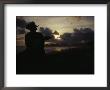 A Cowboy On His Horse Enjoys Sunrise On A Beach by Raul Touzon Limited Edition Pricing Art Print