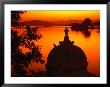 Silhouette Of Domed Building On Shore Of Lake Pichola At Sunset, Udaipur, Rajasthan, India by Dallas Stribley Limited Edition Print