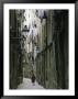 A Woman Walking Along The Narrow Streets Of Bracelona, Spain by Michael Melford Limited Edition Print