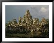 Exterior Of Angkors Bayon Temple Ruins by Richard Nowitz Limited Edition Print