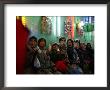 Afghan Boys Watch A Movie On A Television, Unseen, As They Eat Ice Cream At An Ice Cream Shop by Rodrigo Abd Limited Edition Pricing Art Print