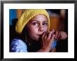 Young Girl Drinking Juice In Cafe, Melbourne, Australia by Richard I'anson Limited Edition Print