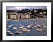 Boats And Waterfront Buildings At Playa De La Concha, San Sebastian, Spain by Dallas Stribley Limited Edition Print