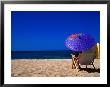 A Girl On The Beach Shading Under A Colourful Umbrella, Waikiki, Oahu, Hawaii, Usa by Ann Cecil Limited Edition Print