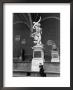 Man Sitting Beneath Statue Of Giambologna's Rape Of The Sabine In Loggia Dei Lanzi by Carl Mydans Limited Edition Print
