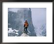 A Man Stands On A Cliff Watching A Snowstorm In Charakusa Valley by Jimmy Chin Limited Edition Print