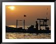 A Silhouetted Boat Fishing For Soft Crabs by Robert Madden Limited Edition Pricing Art Print