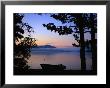 Silhouette Of A Motor Boat On The Shores Of A Bay In Alaska by Joel Sartore Limited Edition Pricing Art Print