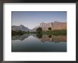 Limestone Rock Formations Are Reflected In Still Waters by Michael Melford Limited Edition Print