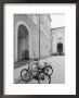 Bicycles In The Domplatz, Salzburg, Austria by Walter Bibikow Limited Edition Print