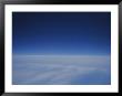 A View Of A Blanket Of Clouds Taken From Inside An Airplane by Raul Touzon Limited Edition Print