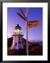 Signpost In Front Of Lighthouse At Dawn, Cape Reinga, New Zealand by Oliver Strewe Limited Edition Print