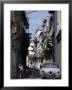 Woman With Baby, Man On Bicycle And Old Car In A Narrow Street Lined With Houses, Havana, Cuba by Rick Gerharter Limited Edition Print