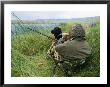 A Hunter Using A Goose Call By A Small Pond In Wyoming by Gordon Wiltsie Limited Edition Pricing Art Print