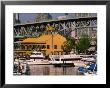 Yachts Docked Near Bridges Restaurant With Granville Island Bridge In Background, Vancouver, Canada by Stephen Saks Limited Edition Print