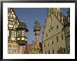Buildings And Statue Of St. George And The Dragon, Rothenburg, Germany by Steve Satushek Limited Edition Print