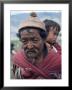 Old Man Carrying Child, Bhutan by Sybil Sassoon Limited Edition Print