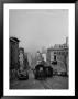 People Riding On Dual Cable Cars, With Bay Bridge Sitting In Background by Charles E. Steinheimer Limited Edition Print