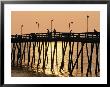 People On A Pier Are Silhouetted At Twilight by Steve Winter Limited Edition Pricing Art Print