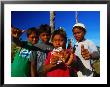 Group Of Boys Holding Flowers, Indonesia by Paul Kennedy Limited Edition Print