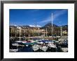 Yachts In Harbour At Intra With Old Town And Mountains In Background, Lago Maggiore, Italy by Martin Moos Limited Edition Print