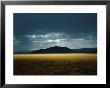The Setting Sun Permeates Rain Clouds To Brighten Black Rock Desert, Nevada by James P. Blair Limited Edition Pricing Art Print