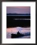 Fisherman In Boat Heading Back To Dock Near Tisza Lake (Tisza To), Tiszafured, Hungary by David Greedy Limited Edition Print