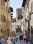 Visitors Explore Streets Of San Gimignano, Italy by Robert Eighmie Limited Edition Pricing Art Print