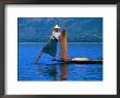 Intha Fisherman Tending To Nets And Rowing, Inle Lake, Shan State, Myanmar (Burma) by Anders Blomqvist Limited Edition Print