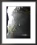 Tourists On Black Water Tubing Expedition In Storms River Gorge, South Africa by Roger De La Harpe Limited Edition Print