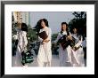 School Girls Facing Ho Chi Minh Statue, Ho Chi Minh City (Saigon), Vietnam, Indochina by Alain Evrard Limited Edition Print