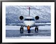 Aircraft At Jackson Hole Airport Surrounded By Snow-Covered Fields And Hills, Jackson Hole, Wyoming by Richard Cummins Limited Edition Print